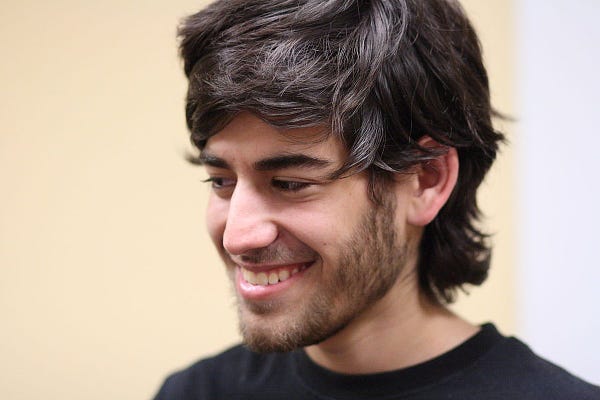 A 2009 portrait of Aaron Swartz. 


Image:
Sage Ross
https://commons.wikimedia.org/wiki/File:Aaron_Swartz_2_at_Boston_Wikipedia_Meetup,_2009-08-18.jpg

CC BY-SA:
https://creativecommons.org/licenses/by-sa/2.0/deed.en
