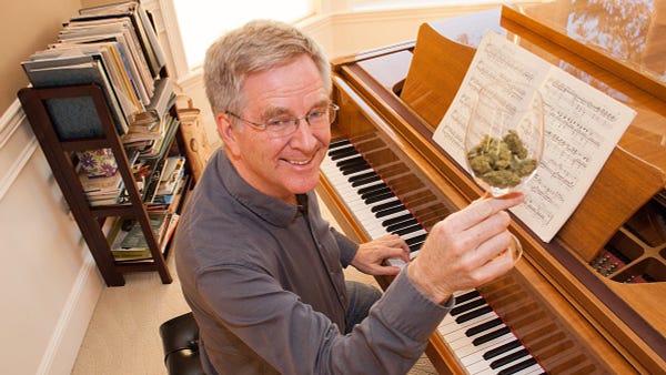 Rick Steves sitting in front of his piano with a wine glass full of weed. Cheers!