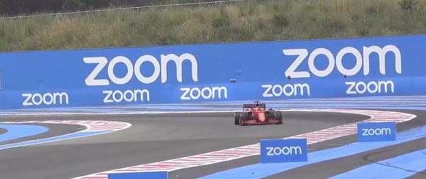 F1 car with the text "zoom" all over the place. Ads for the zoom video conference tool but it can also be car go zoom zoom