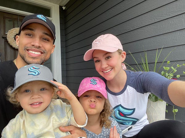 Seattle Kraken new TV Color Analyst taking a selfie with his wife & two kids in Kraken gear