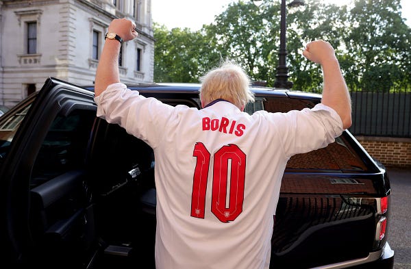 Prime Minister Boris Johnson leaves No10 Downing Street in his England shirt to watch England v Denmark in the semi-final of the Euro 2020 Championships.