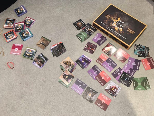 An array of story engine deck and deck of worlds cards spread happily on a carpet