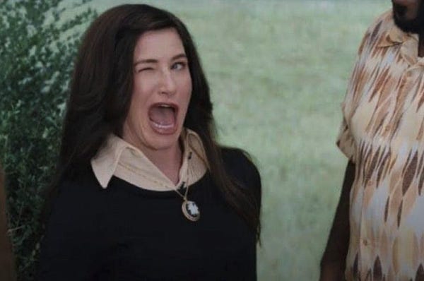 Winking meme of Agnes Harkness played by Kathryn Hahn.