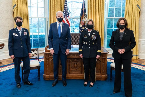 President Biden poses for a photo with Vice President Kamala Harris, General Jacqueline Van Ovost, and Lieutenant General Laura Richardson in the Oval Office