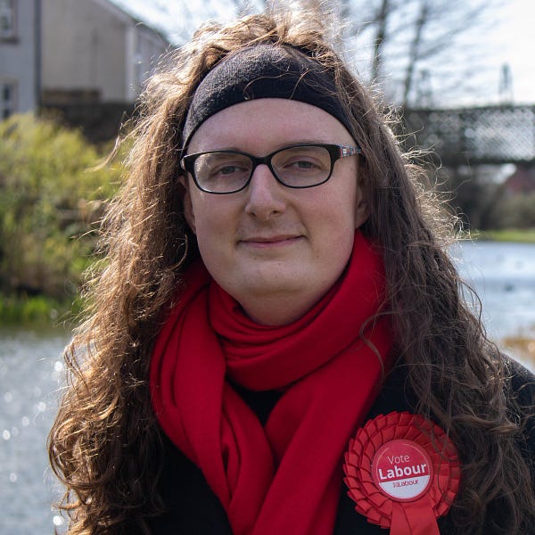 Photo of Anna with a Labour rosette.