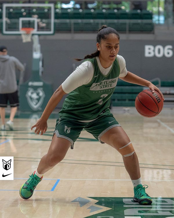 Action photo of Portland State women's basketball player Mia 'Uhila going through a dribbling drill during a team practice.