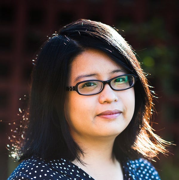 A headshot of Ivy Shih. She is wearing glasses with black rims and has shoulder-length black hair. 