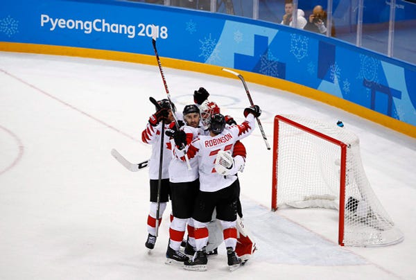 Canada hockey team celebrats after the men's bronze medal hockey game against the Czech Republic at the 2018 Winter Olympics in Gangneung, South Korea, Saturday, Feb. 24, 2018. Canada won 6-4. (AP Photo/Charlie Riedel) 
