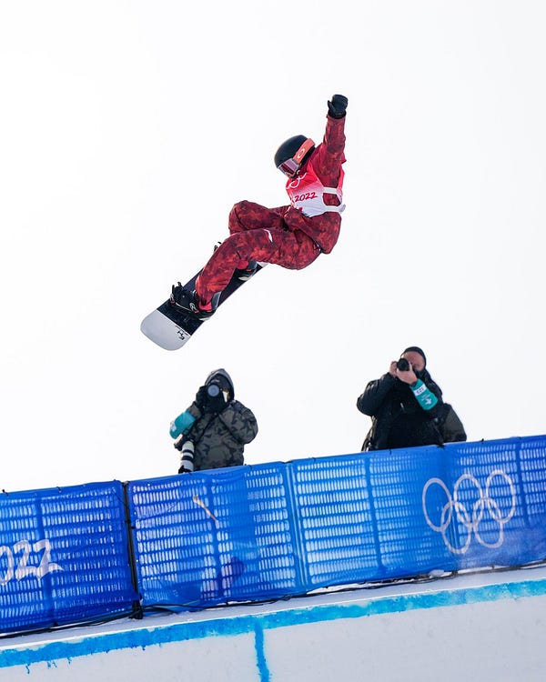 A snowboarder in the air