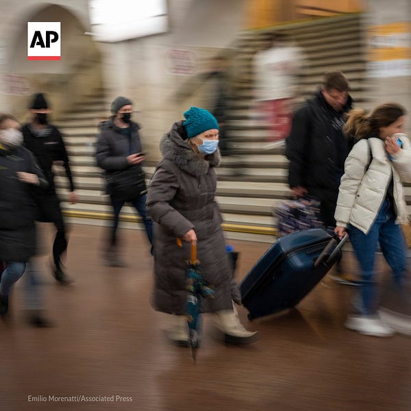 People walk in a subway to get a train as they leave the city of Kyiv, Ukraine.
