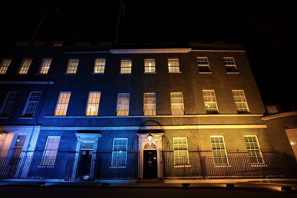 The front of Downing Street lit up blue and yellow.