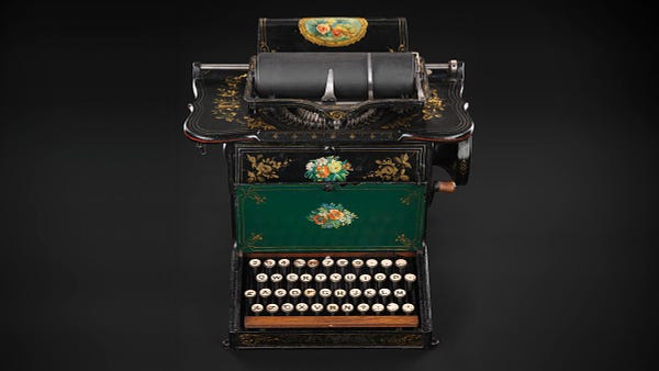 Sholes & Glidden typewriter with floral decorations.