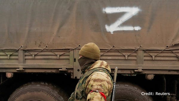 Pro-Russian troops gather in a settlement in Donetsk region