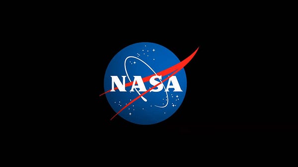 The round insignia of NASA appears on a solid background. Nicknamed the "meatball," the round shape of the insignia represents a planet. The stars represent space. The red v-shaped wing represents aeronautics. The circular orbit around the agency's name represents space travel.