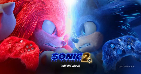 Sonic and Knuckles looking at each other ready to battle with blue and red controllers in bottom corners. 