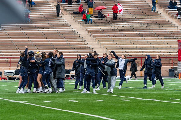 Yale celebrates the win, its first at Cornell since 2004