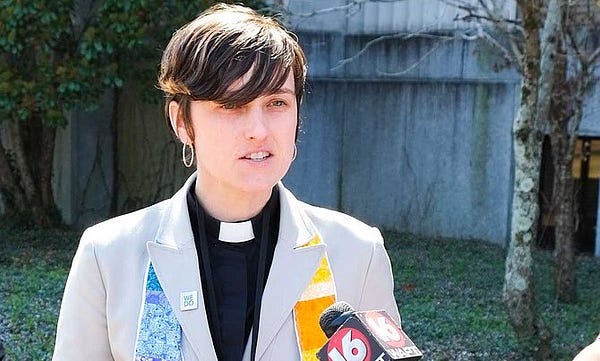a woman in a priest collar speaks to a news crew