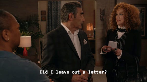 Schitt’s Creek Ronnie’s Party. Johnny and Moira at Ronnie’s house. Johnny Rose speaking to Ronnie captioned “I have been very, very supportive of the LGBTQ community.”
Moira Rose to Johnny Rose captioned “Oh, John... John…”
Johnny Rose back to Moira captioned “Did I leave out a letter?”