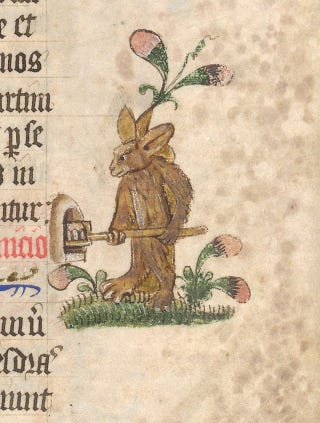 a medieval drawing of an anthropomorphic rabbit using a wooden peel to put a loaf of bread in an oven