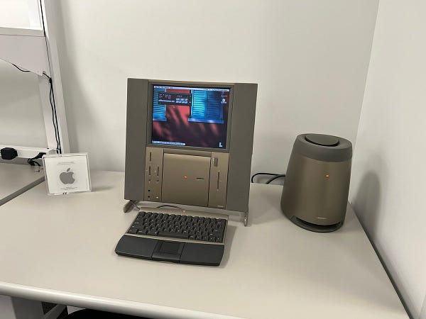 A 20th Anniversary Macintosh, with a 2002 Apple Design Award next to it.