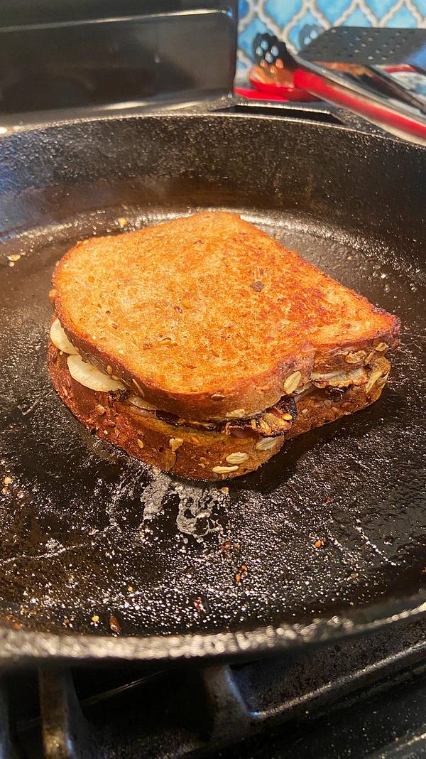 A two faced grilled sandwich on cast iron