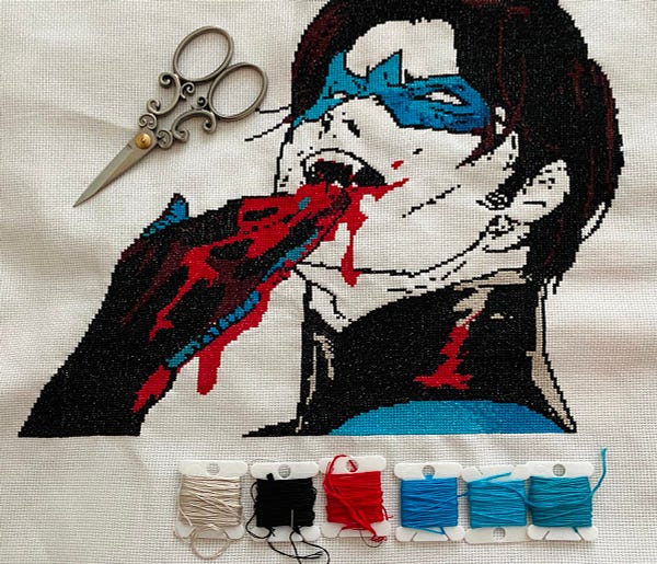 A cross stitch of the vampire king Nightwing licking blood off his hands from DC vs Vampires #6. 