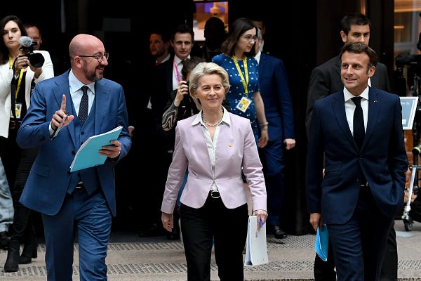 From left to right: President of the European Council Charles Michel, President of the European Commission Ursula von der Leyen and French President Emmanuel Macron walking at the European Council summit in Brussels. 
