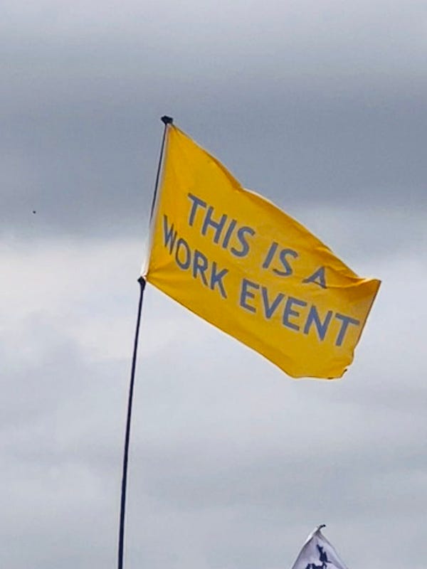 Glastonbury Flag: “this is a work event.”