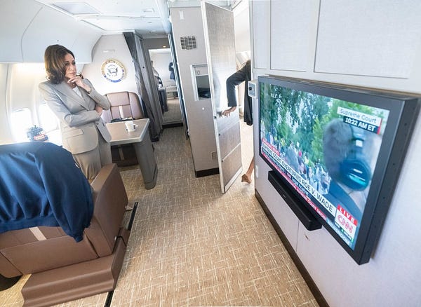 Vice President Harris watches CNN coverage of the Supreme Court decision in her cabin on Air Force Two. 