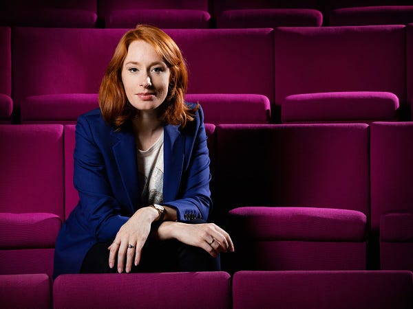 One of Hannah Fry's Christmas Lecturer portraits, pictured in the Ri Theatre among the iconic magenta seats