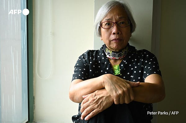 This photo taken on October 19, 2020 shows pro-democracy activist Alexandra Wong, nicknamed "Grandma Wong", posing for a photo in her hotel room in Hong Kong. Wong, who became a fixture of Hong Kong's democracy protests was jailed on July 13, 2022 for eight months for unlawful assembly, a day after courts imprisoned a terminally ill 75-year-old activist. (Peter Parks / AFP)