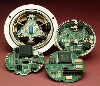 The Honeywell HG1700 IMU disassembled, showing the accelerometer/gyro assembly and three round circuit boards.
Photo from "The International GMLRS Development Program".