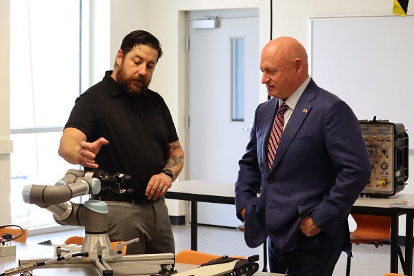Mark Kelly is given a tour of the Maricopa Community College’s Semiconductor Technician Quick Start program site located at the Estrella Mountain Community College-West MEC campus.