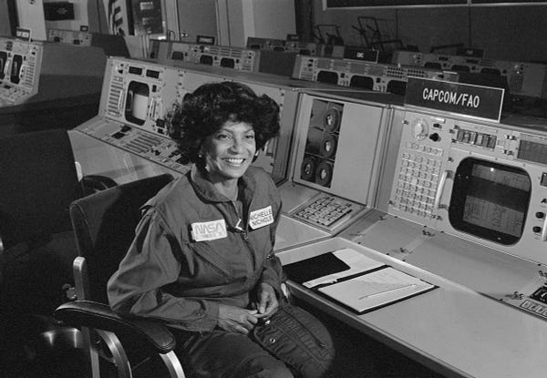 View of Star Trek actor Nichelle Nichols in the CAPCOM area of the Mission Control Center at NASA's Johnson Space Center in 1977. Image taken during filming of promotional movie designed to aid in recruiting minorities as candidates for Space Shuttle Astronaut positions.