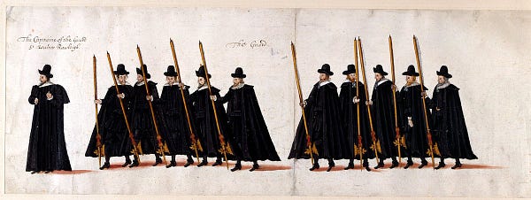 funeral procession showing military guard in black cloaks