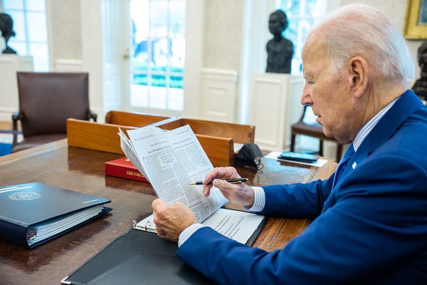 President Biden reads the paper.