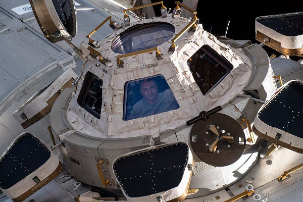 NASA Astronaut Kjell Lindgren looks out from a window on the cupola, the International Space Station's "window to the world."