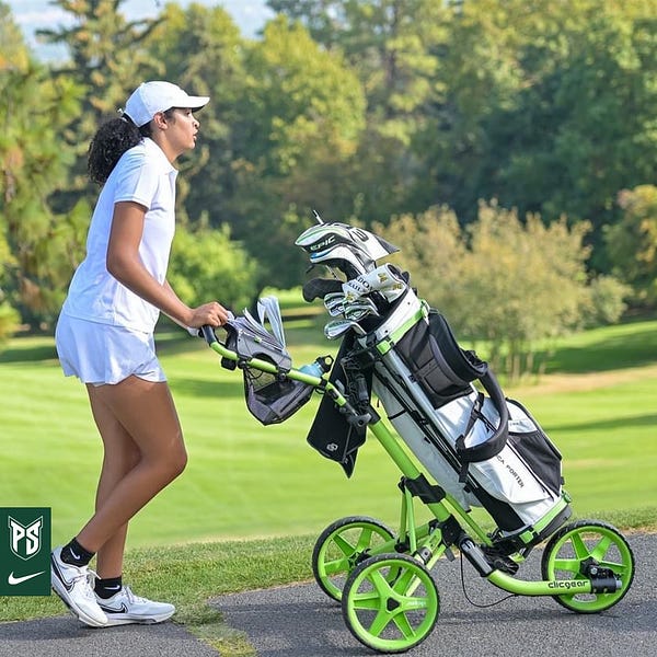 Tannica Porter pushes her cart and clubs at the Eagle Invitational.