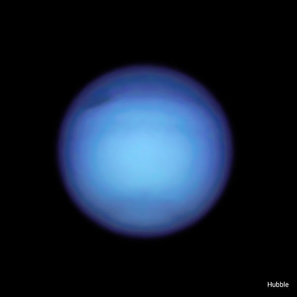 The planet Neptune appears bright blue against a black backdrop of space.