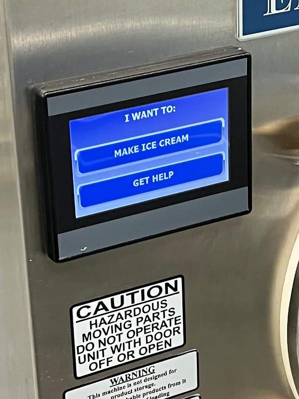 An electronic display panel on a metal machine, bearing the words:
I want to:
·make ice cream
·get help