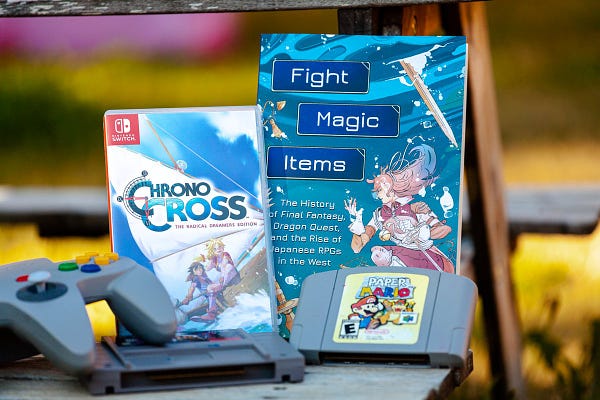 Aidan Moher's Fight, Magic, Items is featured outside nestled among retro video games.