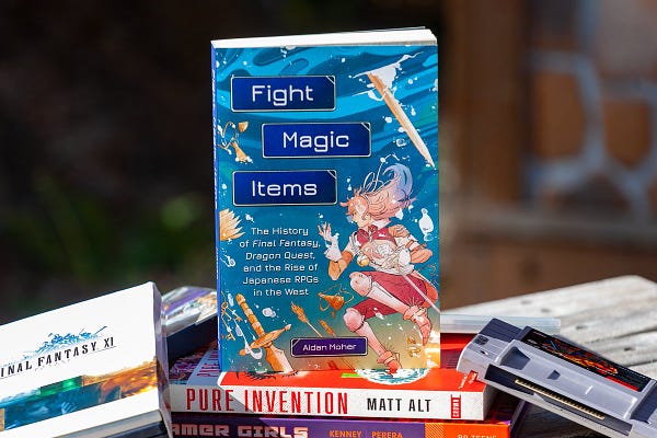 Aidan Moher's Fight, Magic, Items is featured outside nestled among retro video games and two other books.