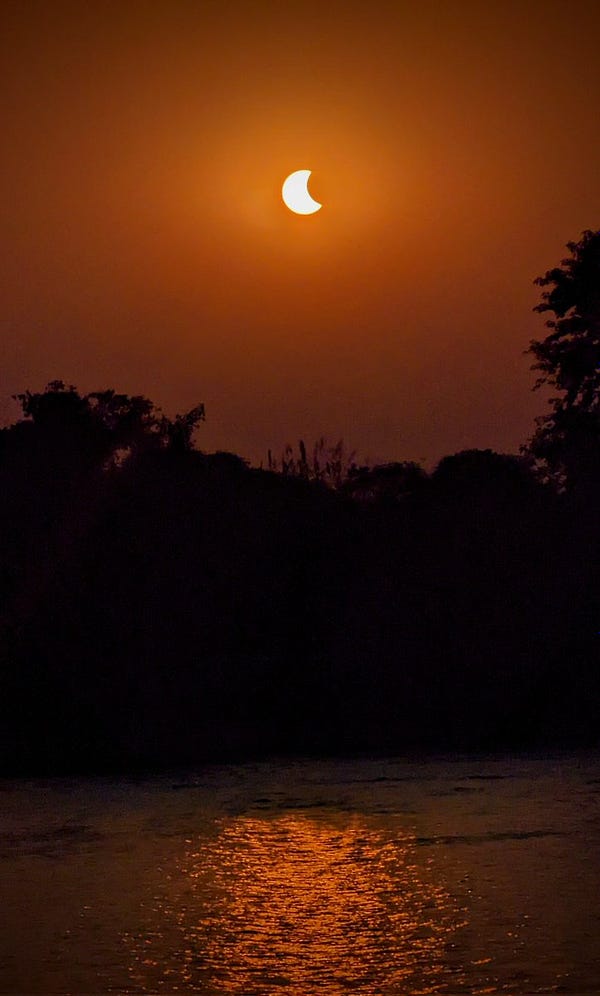 Partial Solar Eclipse, with a glimmer over Tiver Ganga in the foreground. 