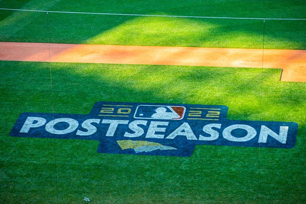 Postseason logo painted onto the grass. 