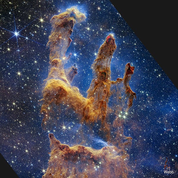 Alt text from NASA: Webb’s near-infrared image shows the a star-forming region, the Pillars of Creation. The pillars are semi-opaque and rusty red-colored. The peaks of the second and third pillars are set off in darker shades of brown and have red outlines. The background is cast in darker blues and blacks, and stars in yellow and white of all sizes speckle the entire scene.