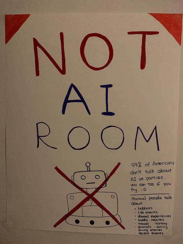 A poster that says “Not AI room” with a drawing of a crossed out robot, and suggestions for alternate topics.