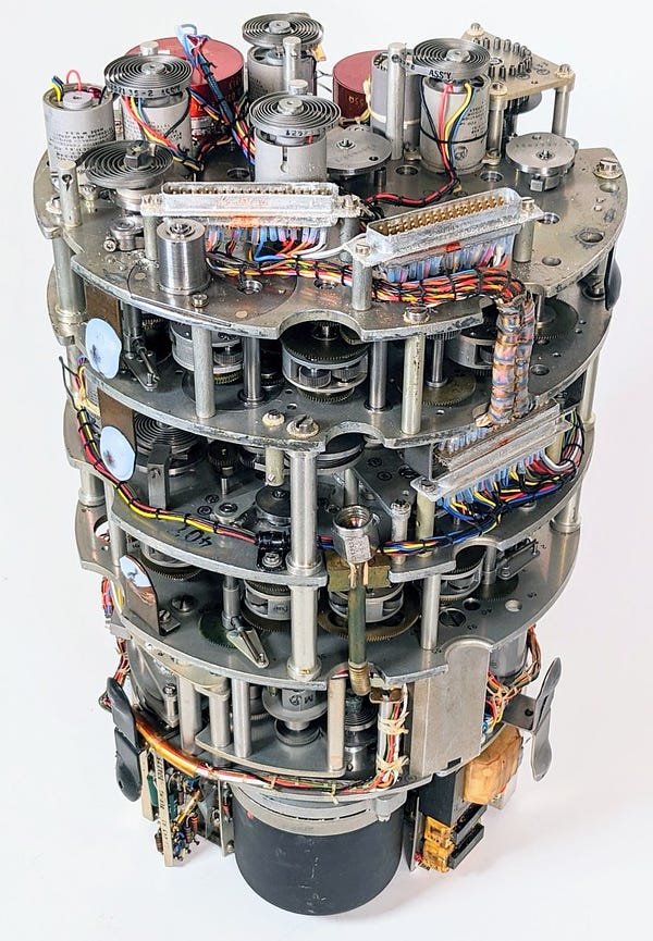 The Bendix Central Air Data Computer with the case removed. Inside are multiple layers of gears, cams, differentials, servos, and so forth.
