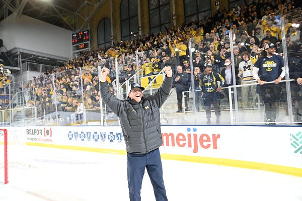 Jim Harbaugh takes the ice as the football team pulls in from Columbus