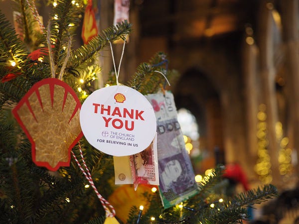 Printed bauble on Christmas tree with shell logo, saying “thank you Church of England for believing in us”