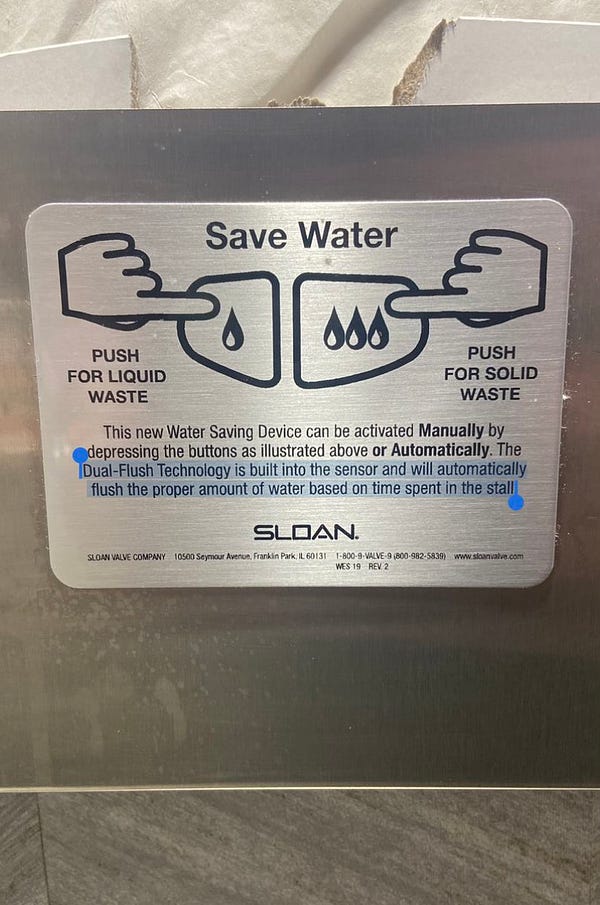 Picture of water saving flush in a public restroom:

“This new Water Saving Device can be activated Manually by depressing the buttons as illustrated above or Automatically. The Dual-Flush Technology is built into the sensor and will automatically flush the proper amount of water based on time spent in the stall.”